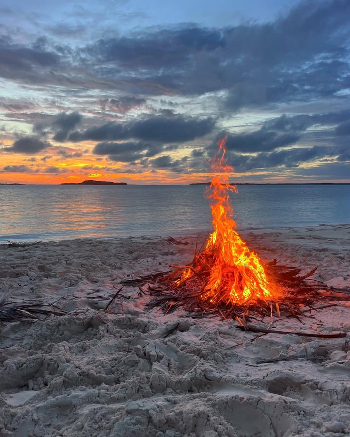 Readying the bonfire for sunset